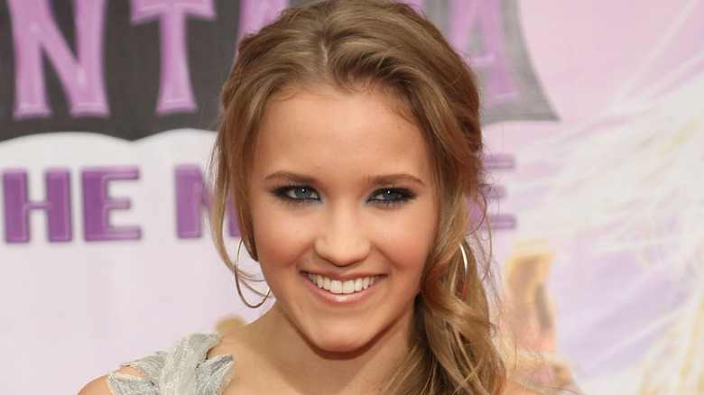 Emily Osment smiles at camera