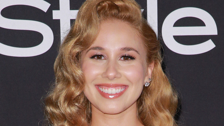 Haley Reinhart on red carpet, smiling