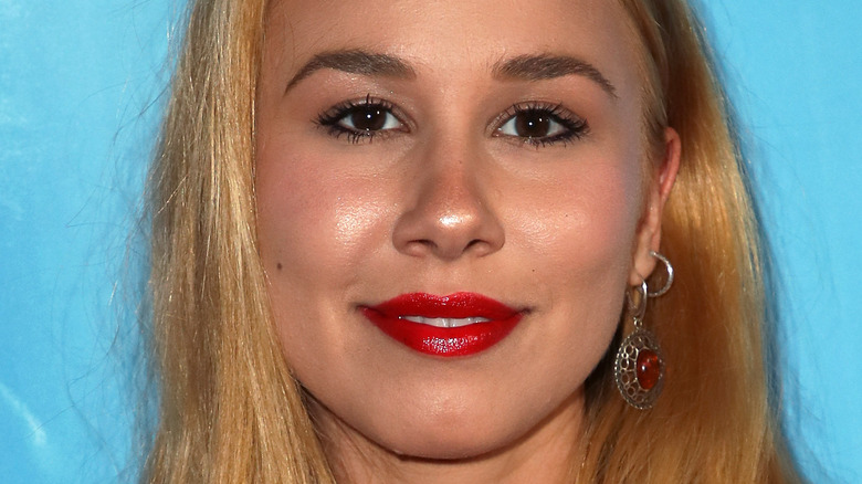 Haley Reinhart on red carpet, smiling