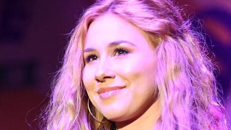 Haley Reinhart on stage, smiling