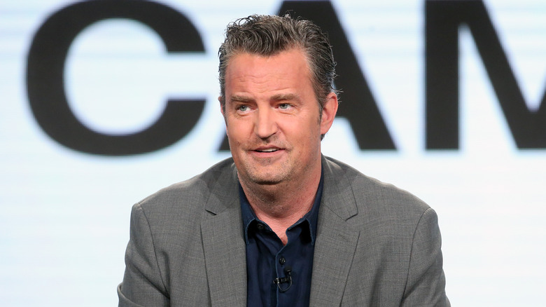 Matthew Perry wearing gray