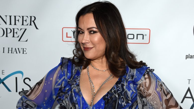 Jennifer Tilly in blue print dress