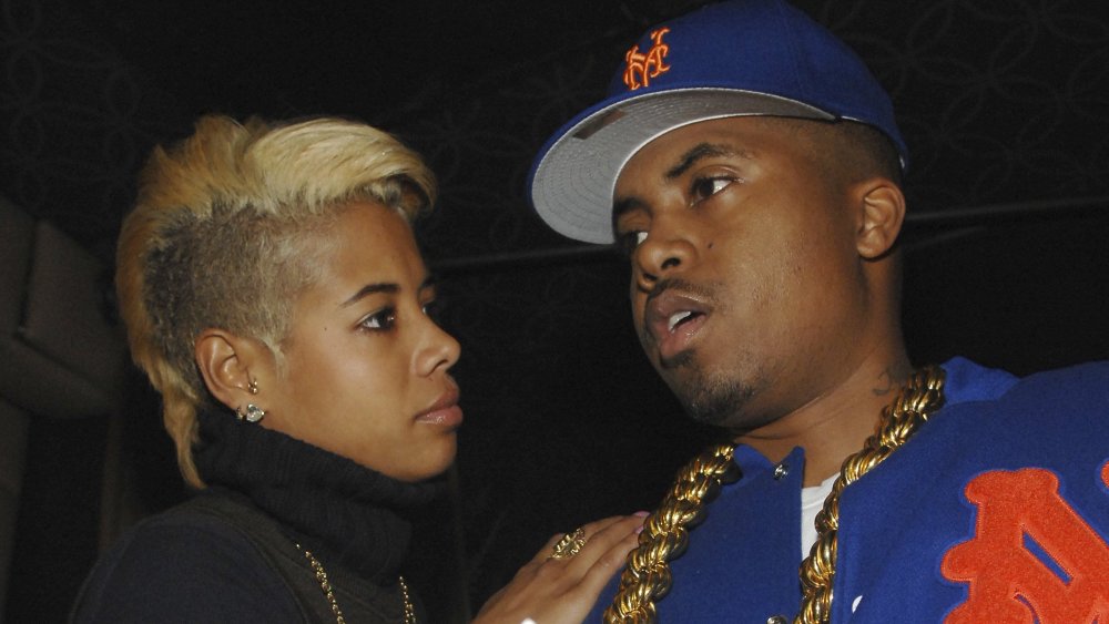 Kelis and Nas looking at each other, not looking too happy