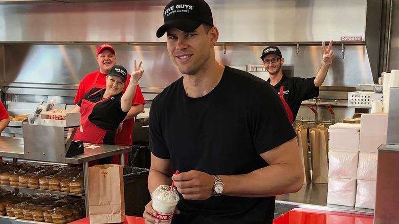 Kris Humphries at a Five Guys restaurant