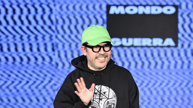 Mondo Guerra waves on a runway 