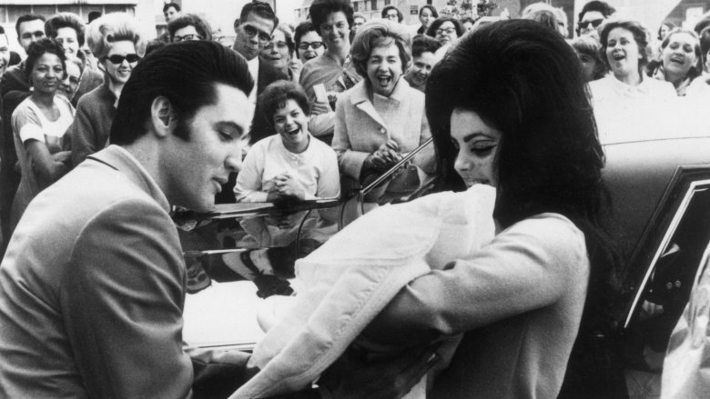 Elvis and Priscilla Presley with daughter Lisa Marie