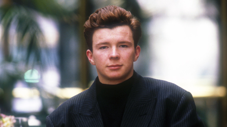 Rick Astley in the 1990s, posing