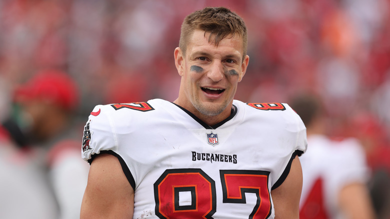 Rob Gronkowski wearing a white and red Buccaneers football jersey