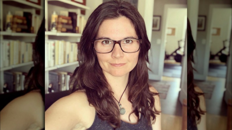 Lisa Jakub posing for selfie wearing glasses