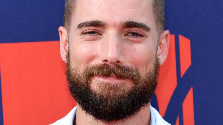 Dustin Milligan smiling