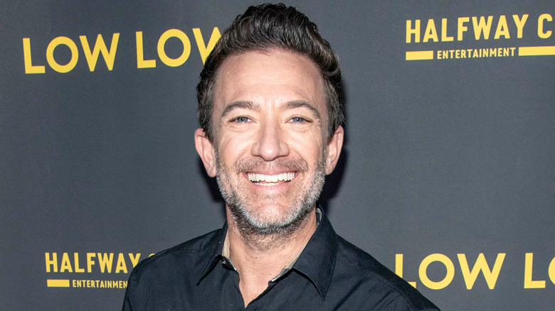 David Faustino at an event, smiling