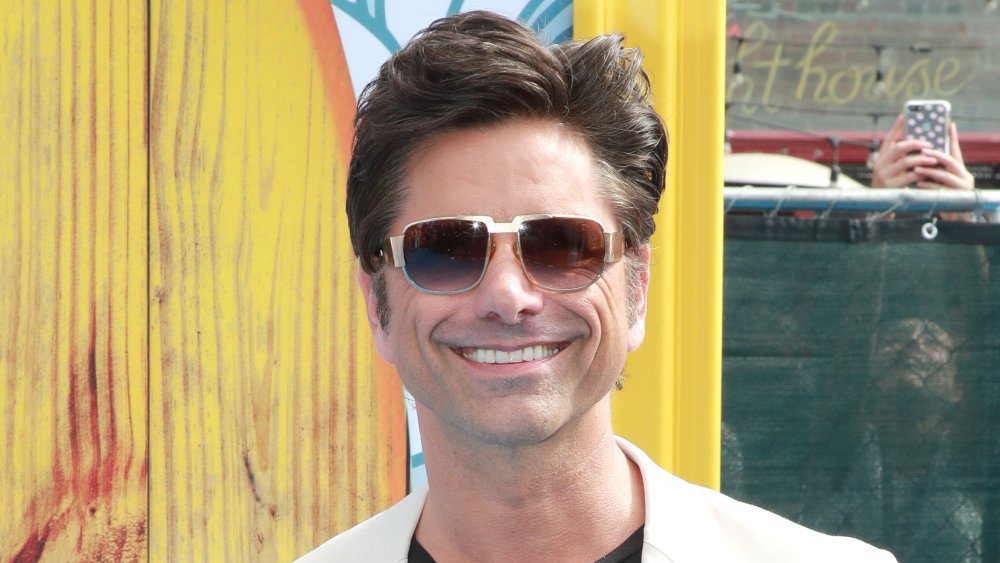 John Stamos with sunglasses on