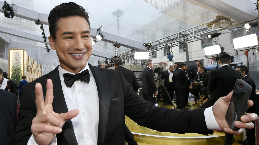 Mario Lopez taking selfie on red carpet