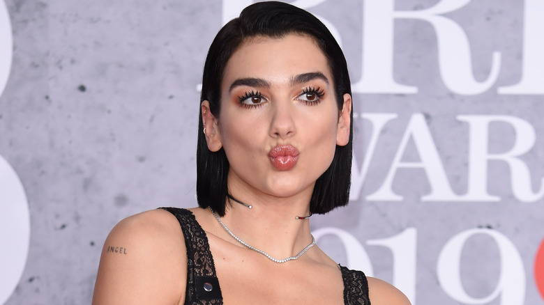 Dua Lipa puckering her lips