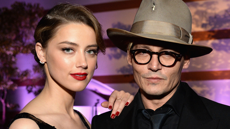 Johnny Depp Amber Heard posing