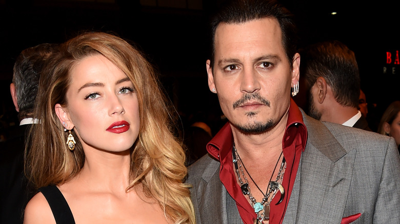 Amber Heard Johnny Depp posing