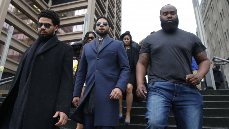 Jussie Smollett walking outside a courthouse