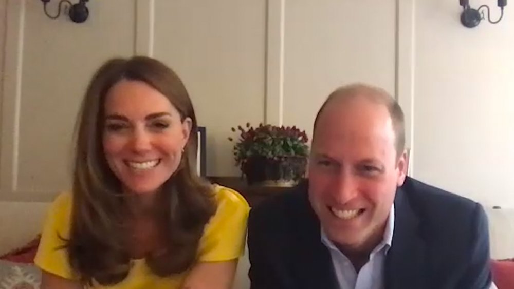 Kate Middleton and Prince William smiling over a Zoom call