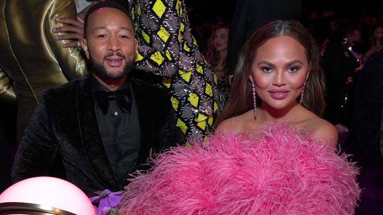 Chrissy Teigen and John Legend at party