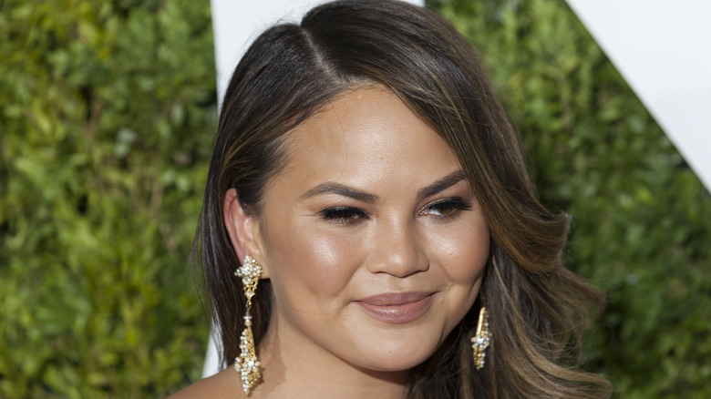 Chrissy Teigen with long diamond earrings