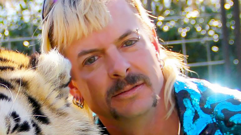 Joe Exotic posing with a tiger