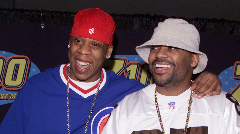 Jay-Z laughing with Damon Dash at event