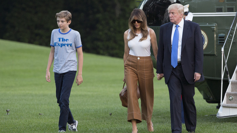 Barron and Melania Trump walking with Donald Trump