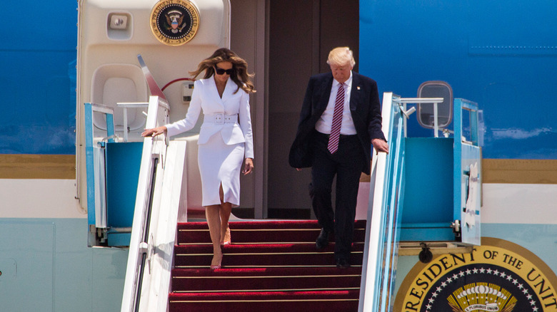 Melania and Donald Trump walking down Air Force One