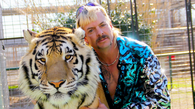 Joe Exotic posing with tiger