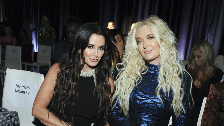 Kyle Richards and Erika Jayne smiling at fashion show