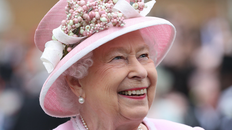 Queen Elizabeth II smiles at the Royal Garden Party