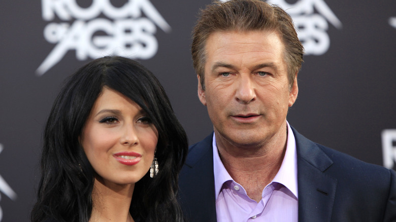 Hilaria Baldwin and Alec Baldwin looking at camera