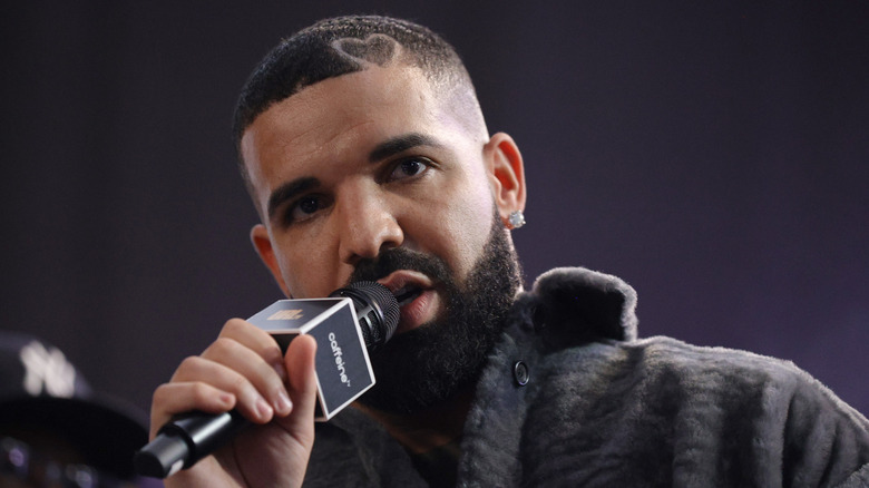 Drake cropped hair with love heart singing