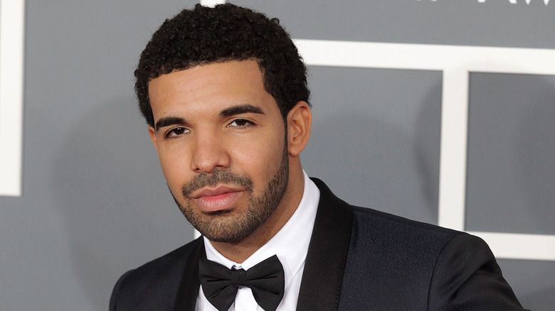 Drake smiling short hair clipped beard