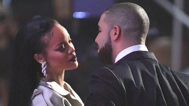 Drake and Rihanna getting close nearly kissing