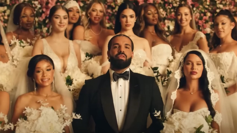 Drake posing with brides