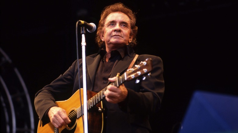 Johnny Cash playing guitar