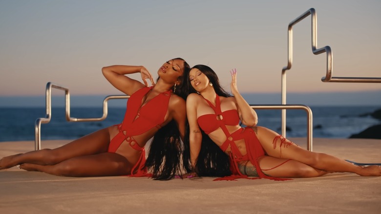 Cardi B. and Megan Thee Stallion wearing red