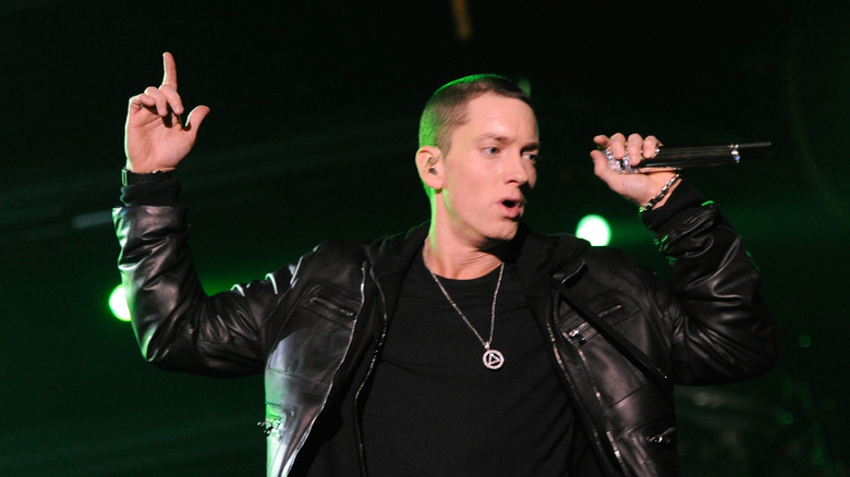 Eminem performing finger pointed up