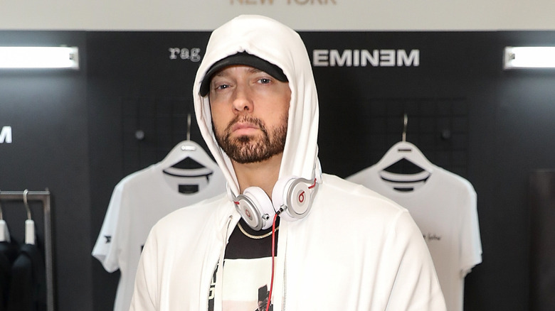 Eminem white hoodie scowling