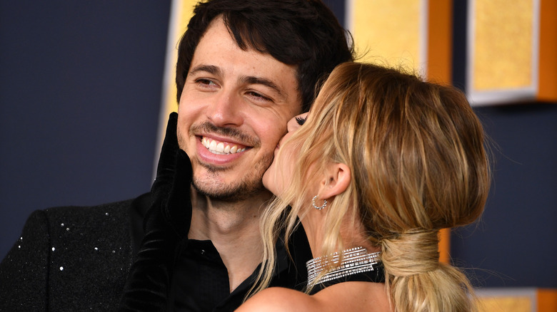 Kelsea Ballerini and Morgan Evans cuddling up for a picture