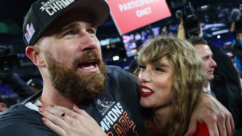 Travis Kelce and Taylor Swift embracing