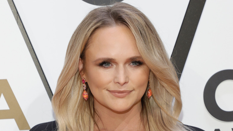 Miranda Lambert wears coral dangle earrings