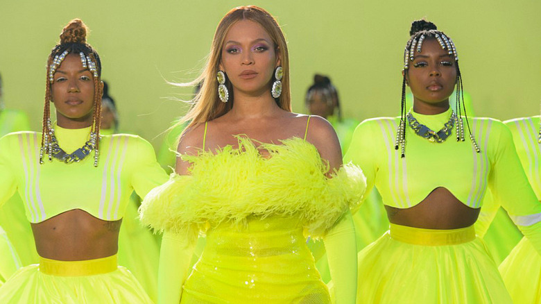 Beyoncé onstage in green feathered dress