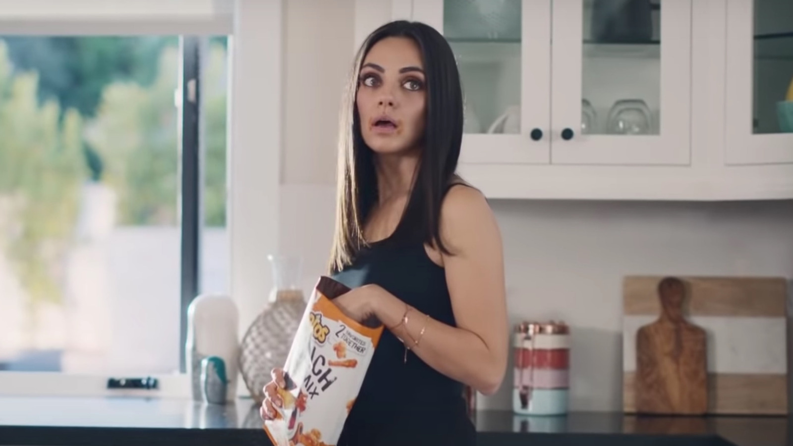 What's The Song In Mila Kunis And Ashton Kutcher's Cheetos Commercial?