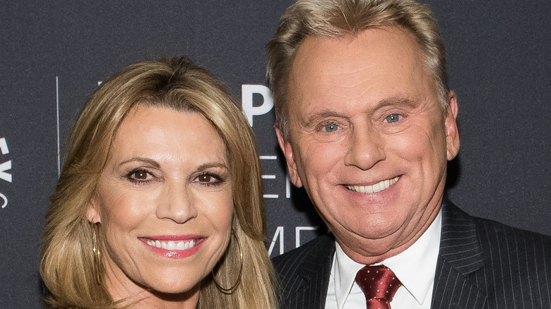 Vanna White and Pat Sajak posing