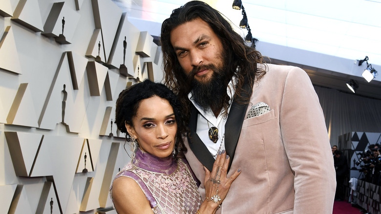 Jason Momoa and Lisa Bonet posing on the red carpet