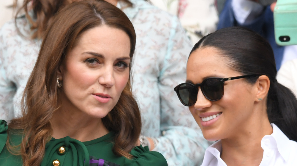 Meghan Markle and Kate Middleton talking