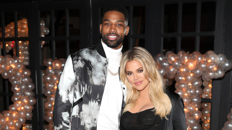 Tristan Thompson and Khloe Kardashian pose for a photo