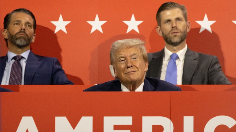 Don Jr., Eric, and Donald Trump sitting